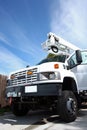 Big white diesel truck with boom