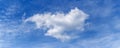 A big white fluffy cloud of a strange shape in the blue sky Royalty Free Stock Photo