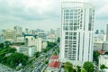 The big white glass building with congested traffic i