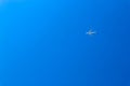 Big white jet airplane airliner in the bright blue sky wallpaper background Royalty Free Stock Photo