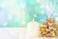 Big White Lit Burning Candle Pine Cone Sparkling Garland Lights Pale Blue Background Christmas New Year Greeting Card Royalty Free Stock Photo