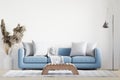 Big white living room.interior design,blue sofa,lamp,wooden table,carpet wall for mock up Royalty Free Stock Photo