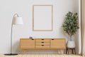 big white living room.interior design,wooden long sideboard,lamp,tree,frame for mockup and copy space