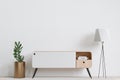 Big white living room.interior design,wooden table,wooden sideboard and empty wall for copy space Royalty Free Stock Photo