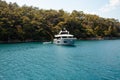 Big white modern yacht moored in Aegean sea near Turkey coast. Luxury white boat yacht against of the resort city. Ships Royalty Free Stock Photo