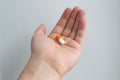 Big white and red color capsule pill on the palm Royalty Free Stock Photo