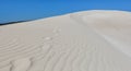 Big white sand dune with footprints. Royalty Free Stock Photo