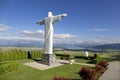 Big white Statue of Jesus over Landscape, Klin, Slovakia