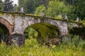 Big white stone bridge in the park Royalty Free Stock Photo