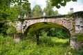 Big white stone bridge in the park of the Serednikovo estate Royalty Free Stock Photo