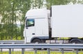 Big white truck goes on highway