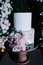 Big white wedding cake with fruit is on the table Royalty Free Stock Photo