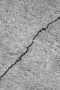 Big winding ascending crack on an gray concrete wall. Thin crack diagonally. Copy space. Vertical photo. Royalty Free Stock Photo