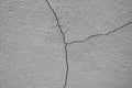 Big winding ascending crack on an old concrete wall. Square divided into three parts. Concrete background. Close-up. Royalty Free Stock Photo
