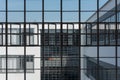 Big window front with partially opened windows of the Bauhaus in Dessau on clear day