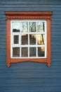 Big window in steelblue wooden wall