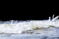 Big windy waves splashing over rocks. Wave splash in the lake isolated on black background. Waves breaking on a stony beach, formi Royalty Free Stock Photo