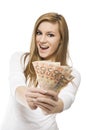 Big Winner - excited smiling girl with money. Young happy laughing and screaming woman in white pullover holding fan of Euro bills Royalty Free Stock Photo