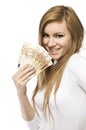 Big Winner - excited smiling girl with money. Young happy laughing woman in white pullover holding fan of Euro bills currency. Royalty Free Stock Photo