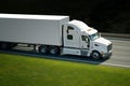 Big withe semi truck on highway Royalty Free Stock Photo