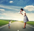 Big woman with megaphone and small woman