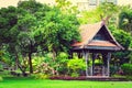 Big wooden asian country style pavilion in the beautiful garden