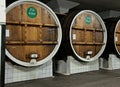 Big wooden barrels with wine in cellar in Massandra winery, Yalta, Crimea Royalty Free Stock Photo