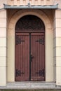 Big wooden brown doors from church. Entrance to the church with big wooden old doors Royalty Free Stock Photo