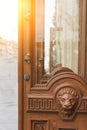 Big wooden head of lion on the front door Royalty Free Stock Photo