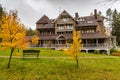 The big wooden house in forest, Drone view point of rural area in Autumn with lake Boroye, Valday national park, Russia Royalty Free Stock Photo