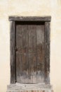 Big wooden old door. Historical house door, one timber leaf, closed brown gateway. Royalty Free Stock Photo