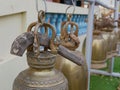 Big wooden stick was put on top of a temple bell ready for visitors to use for ringing the bells, as the sound of the bell is