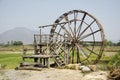 Big wooden turbine baler water wheel at Thai Dam Cultural Village Royalty Free Stock Photo