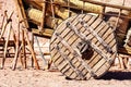 Big wooden wheel of a cart wagon with hay Royalty Free Stock Photo