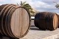 Big wooden wine barrels at the entrance to the vineyard. Lanzarote