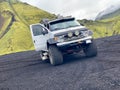 A big 4x4 Offroad Truck in a Landscape with black Sands in Iceland Royalty Free Stock Photo