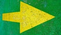 Big yellow arrow pointing to the right with green background