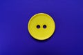 Big yellow button isolated on a blue background. Royalty Free Stock Photo