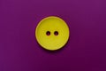 Big yellow button isolated on a purple background. Royalty Free Stock Photo