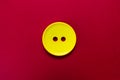 Big yellow button isolated on red background. Royalty Free Stock Photo