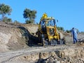 Big Yellow Digger Excavating New Dirt Road Royalty Free Stock Photo