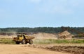 Big yellow dump trucks working in the open-pit. Royalty Free Stock Photo