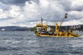 Big, yellow fishing boat and fishermen