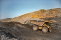 Big yellow mining truck empty body for anthracite. Open pit mine, extractive industry for coal Royalty Free Stock Photo