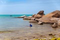 Big yellow rocks in the sea against the blue sky. Floating man in mask and flippers. Thailand. Samui. Gulf of Thailand. Lamai Royalty Free Stock Photo
