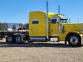 Big Yellow Sleeper Cab and Flat Bed Trailer! Transportation and Logistics! Royalty Free Stock Photo