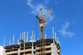 Big yellow stationary hoist on construction site Royalty Free Stock Photo