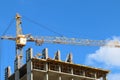 Big yellow stationary hoist on construction site Royalty Free Stock Photo