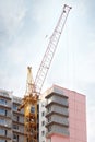 Big yellow stationary hoist and part of building Royalty Free Stock Photo