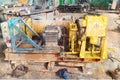 Big yellow stationary winch inside the production hall. An appar